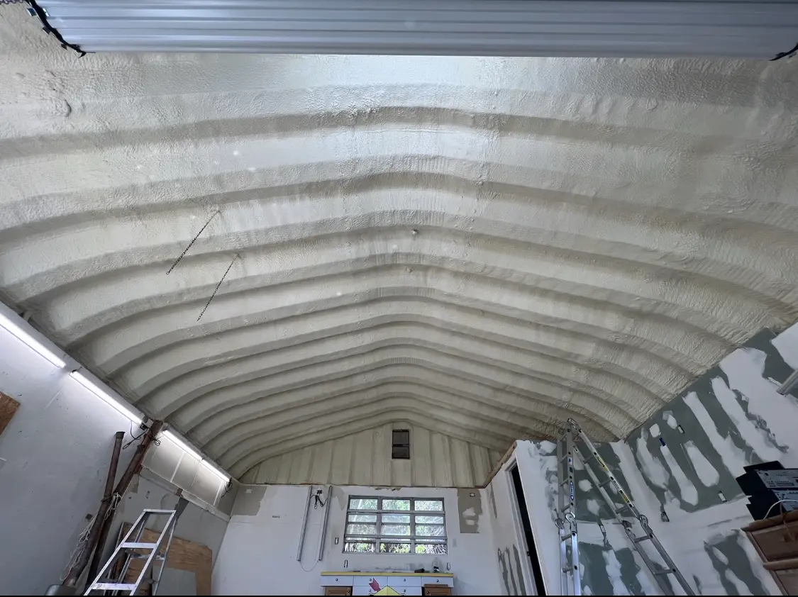 Spray polyurethane foam applied to the underside of a metal roof deck in Langley Park
